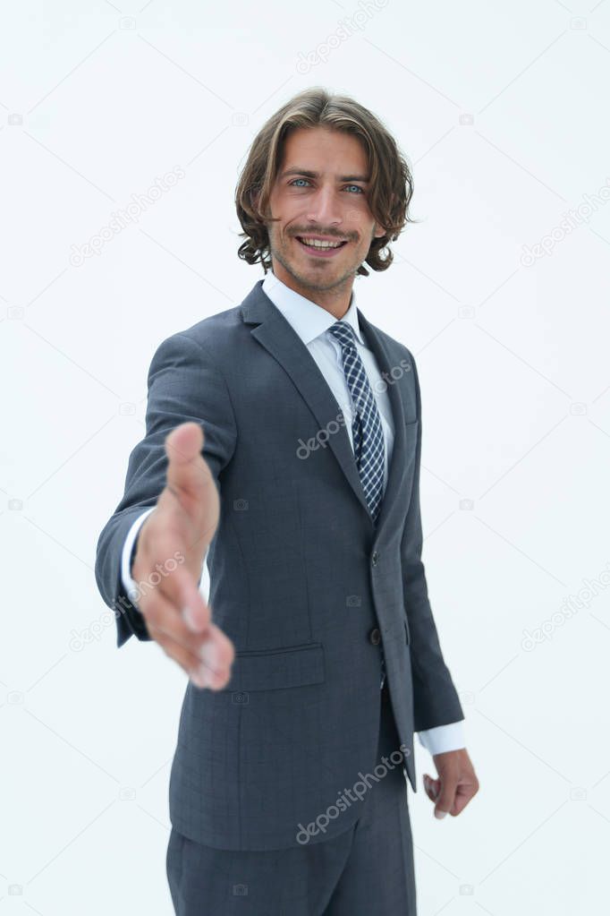 Smiling friendly businessman offers a handshake