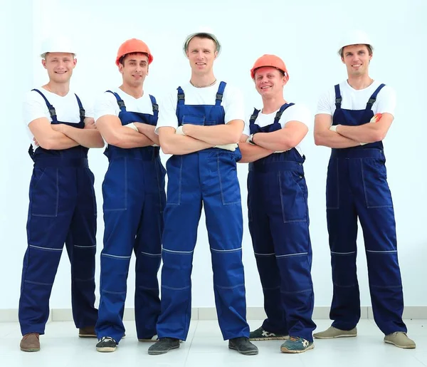 Team of professional builders in helmets — Stock Photo, Image