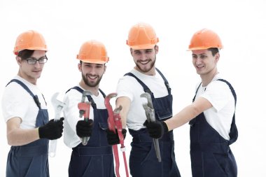 Tesisatçılar çalışma araçları ile grup