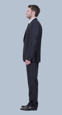 Gri arka plan üzerinde izole iş adamı yan görünüm.