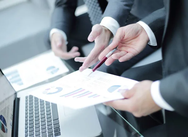 Business team hands at work with financial reports — Stock Photo, Image