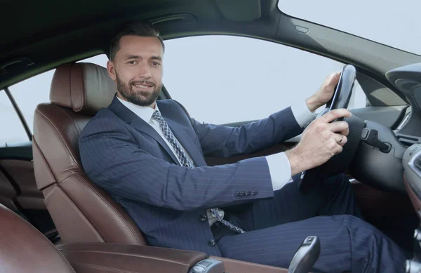 Portrait of confident businessman driving a car — Stock Photo, Image