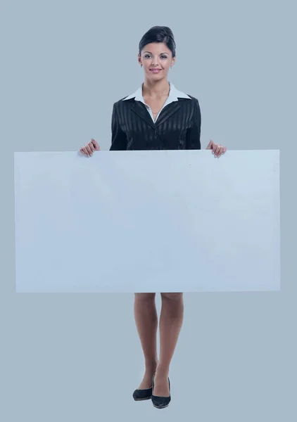 Happy businesswoman holding a poster with copy space — Stock Photo, Image