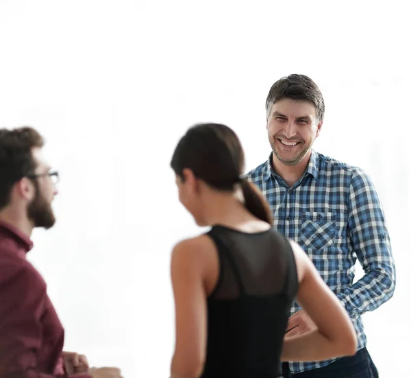 Portrait of confident businessman with colleagues, background — Stock Photo, Image