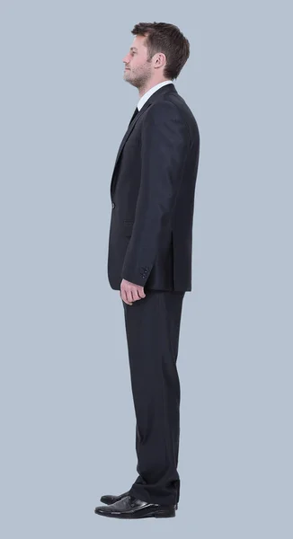 Zijaanzicht van zakenman geïsoleerd op een grijze achtergrond. — Stockfoto
