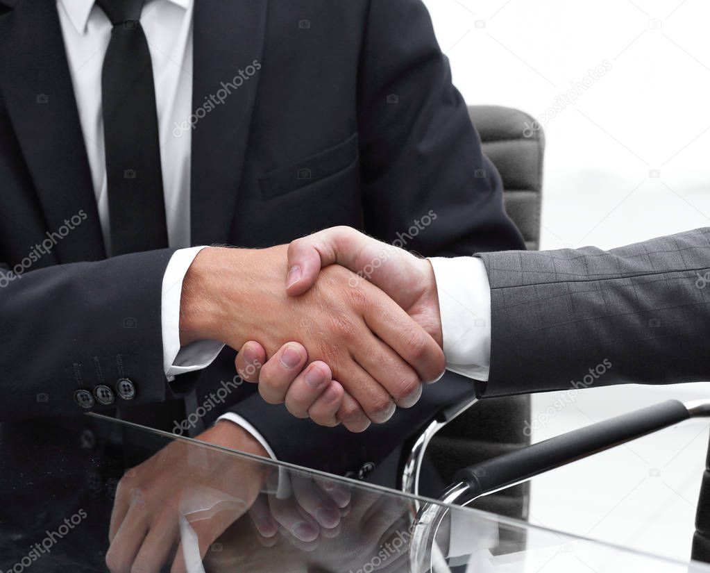 handshake reliable partners in the office.