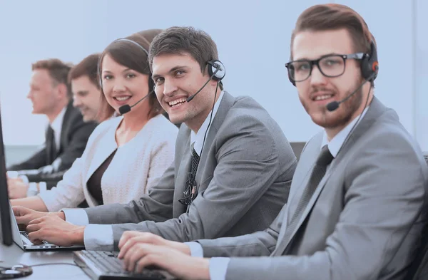 Customer service representative with headset in call center — Stock Photo, Image