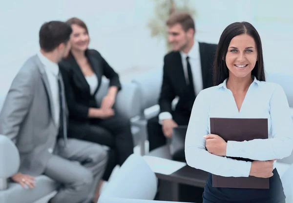 Smiling female assistant with documents — Stock Photo, Image