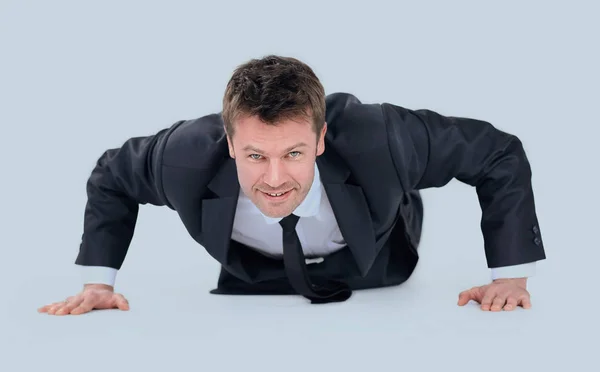 Young businessman being wrung out from a floor — Stock Photo, Image