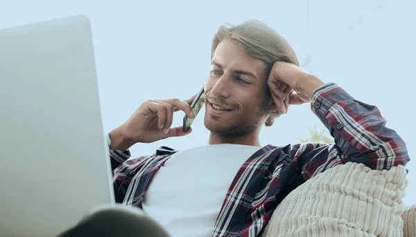 Close-up of a successful guy talking to a smartphone — Stock Photo, Image