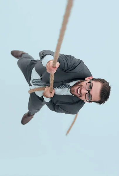 Exitoso hombre de negocios trepando la cuerda — Foto de Stock