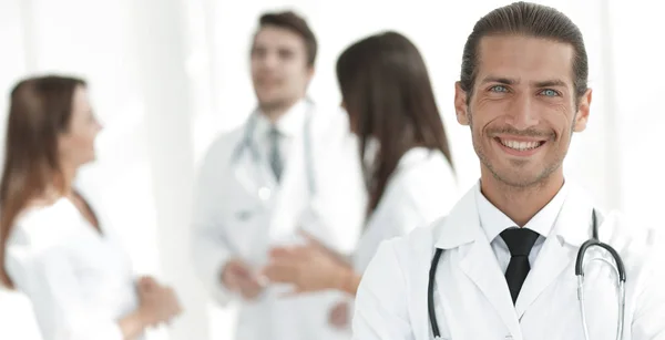 Smiling doctor therapist on blurred background. — Stock Photo, Image