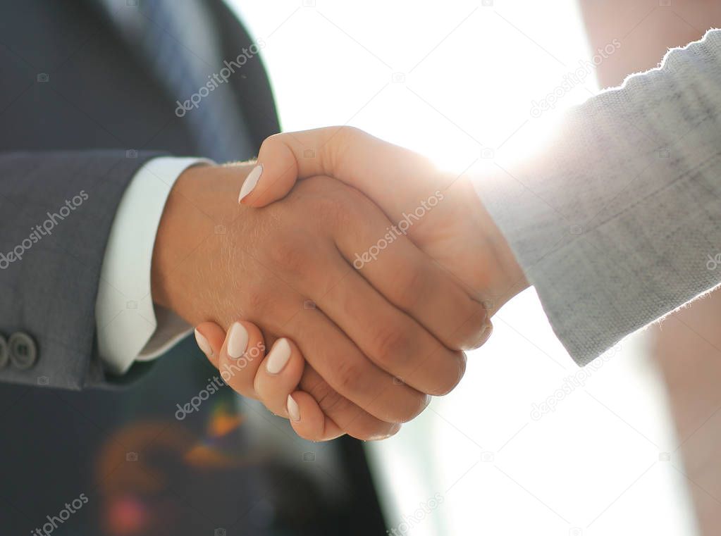 Business people shaking hands isolated on white background