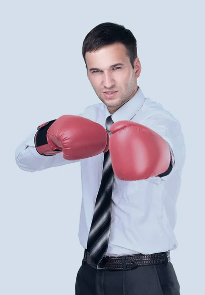 Empresário pronto para lutar com luvas de boxe sobre branco — Fotografia de Stock