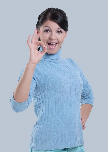 Portrait of  a beautiful woman showing the OK sign over white — Stock Photo, Image