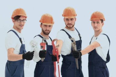 Tesisatçılar çalışma araçları ile grup