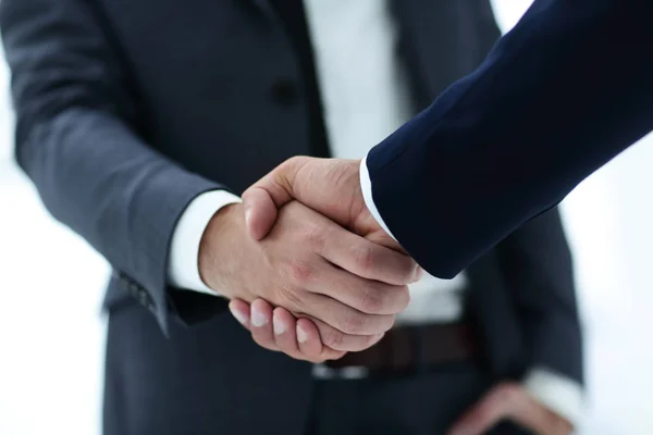 Close up of two young male business partner shake hand — Stock Photo, Image
