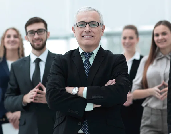 Portrait of senior businessman and employees of the company. — Stock Photo, Image
