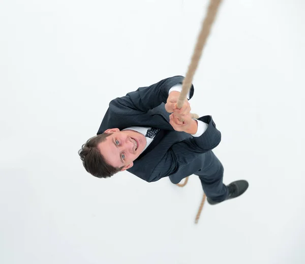 Empresário bem sucedido escalando a corda — Fotografia de Stock