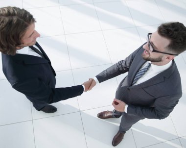 İş tokalaşması ve iş adamları kavramları.