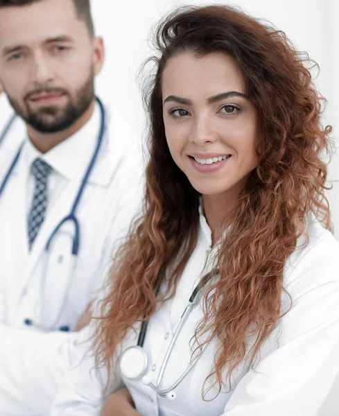 Portrait of female doctors with colleagues — Stock Photo, Image