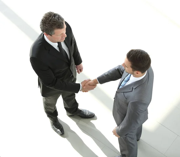 Pohled z top.the handshake obchodních partnerů — Stock fotografie