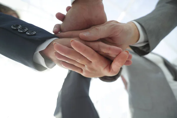 Business people folding their hands together. — Stock Photo, Image