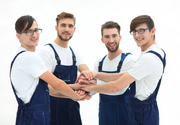 Team of movers joining hands. — Stock Photo, Image