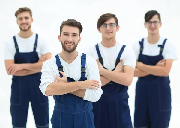 Happy team of responsible movers and their smiling leader. — Stock Photo, Image