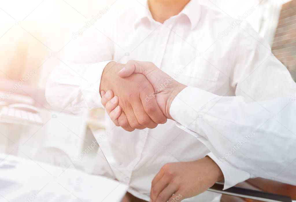 close-up handshake of business colleagues.