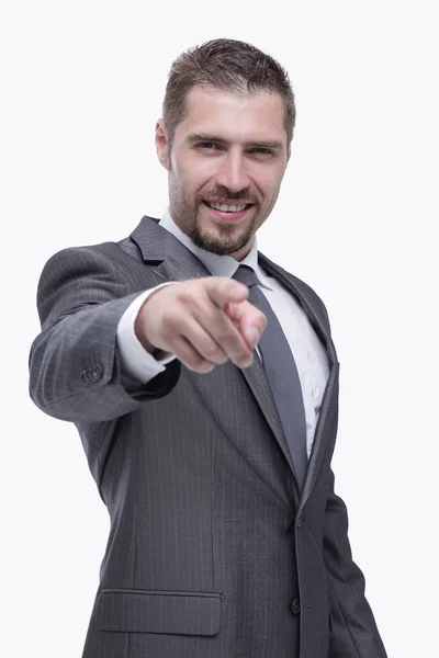 In full growth.closeup.confident businessman pointing forward . Royalty Free Stock Images