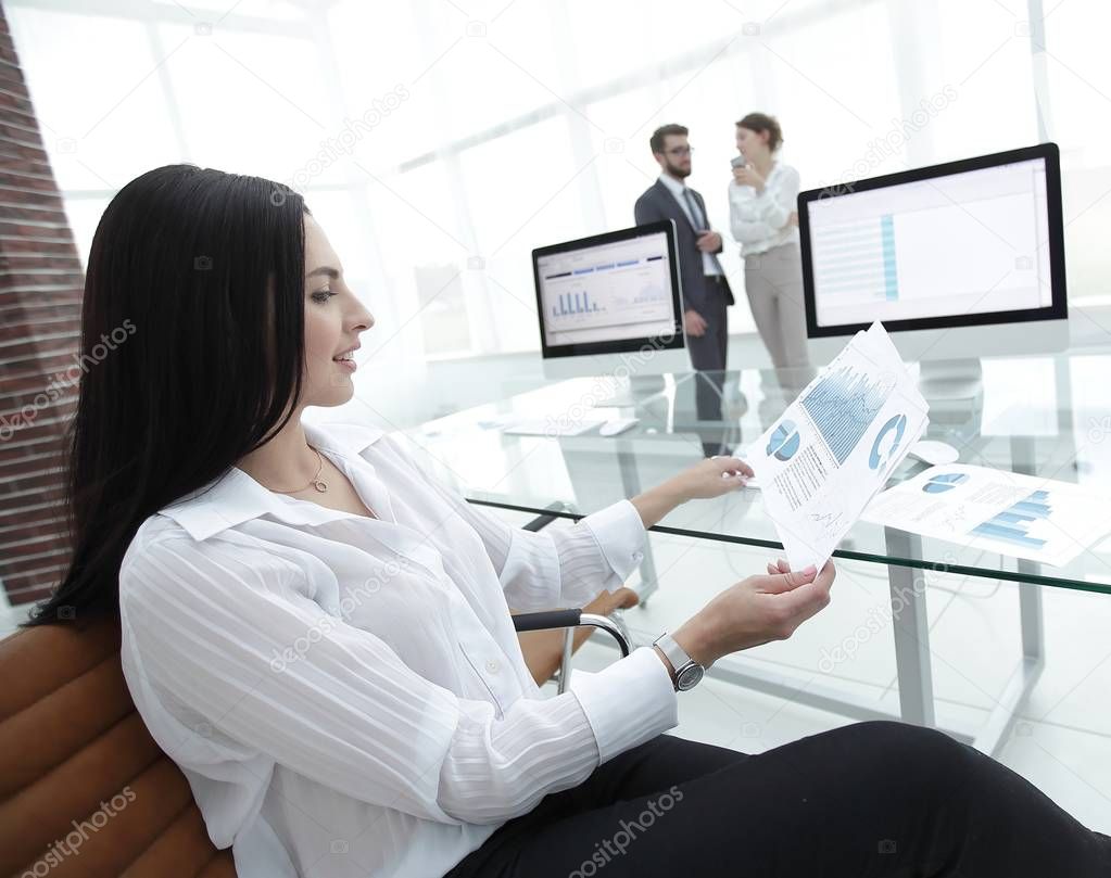 business woman working with financial charts in a modern office