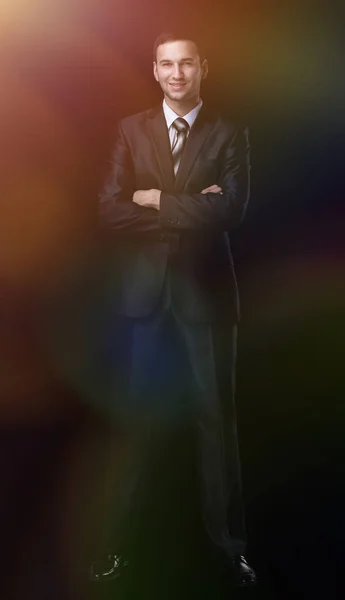 Full length of young successful manager smiling isolated on black — Stock Photo, Image