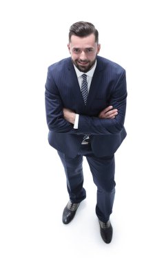 İş adamı kameraya bakıyor.