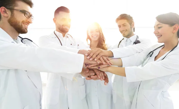 Doctors and nurses in a medical team stacking hands — Stock Photo, Image