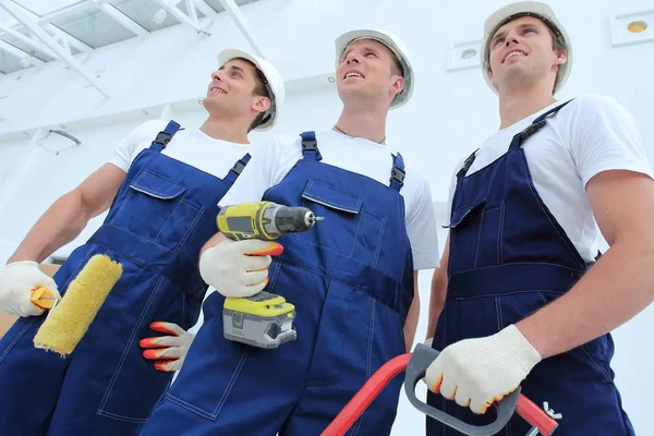 Equipe profissional de construtores com ferramentas — Fotografia de Stock