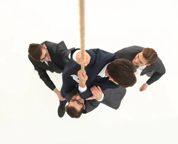 Top view .business equipo ayuda al líder a subir . —  Fotos de Stock