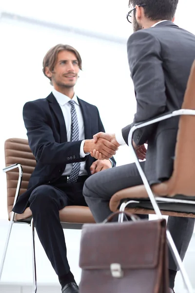 close-up of a businessman holding a briefcase