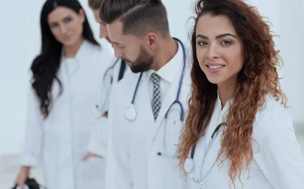 Portrait of female doctors with colleagues — Stock Photo, Image