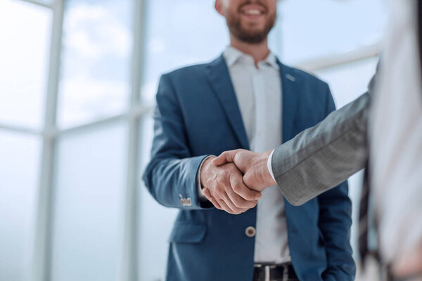 business partners shaking hands . concept of partnership