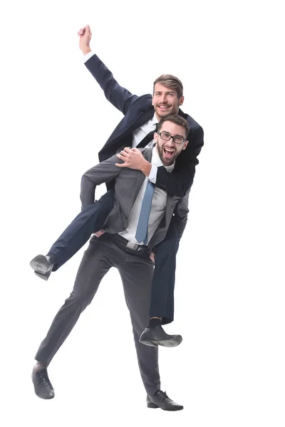 Homem de negócios feliz carregando seu colega no piggyback — Fotografia de Stock