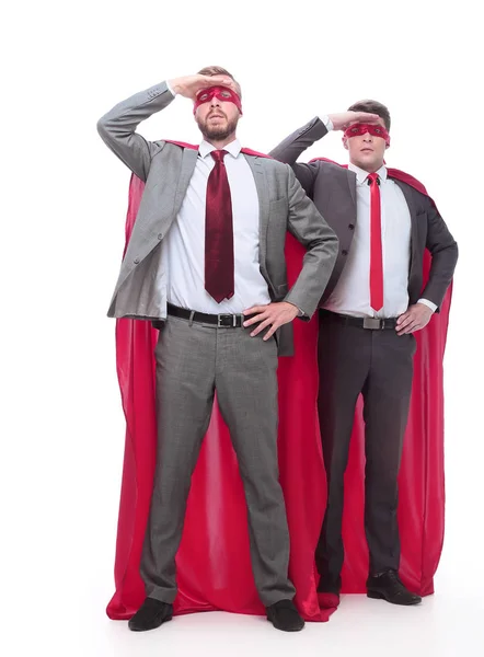 In full growth. superheroes businessmen looking carefully into the distance — Stock Photo, Image