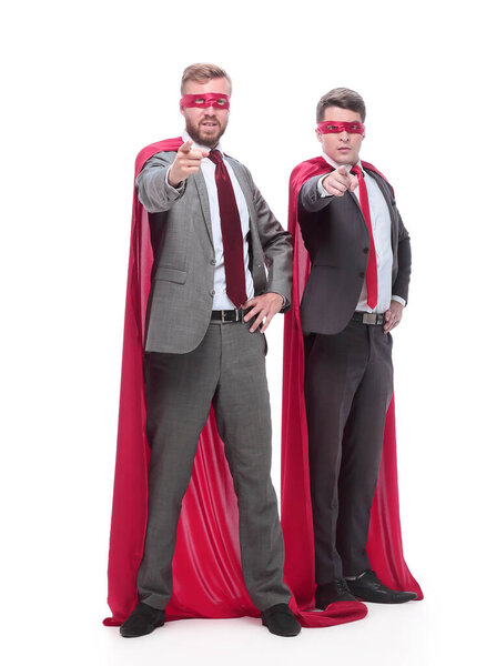 two confident superhero businessmen are pointing at you