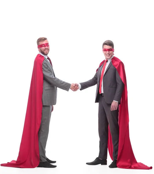 Businessmen in superhero capes, shaking hands with each other — Stock Photo, Image