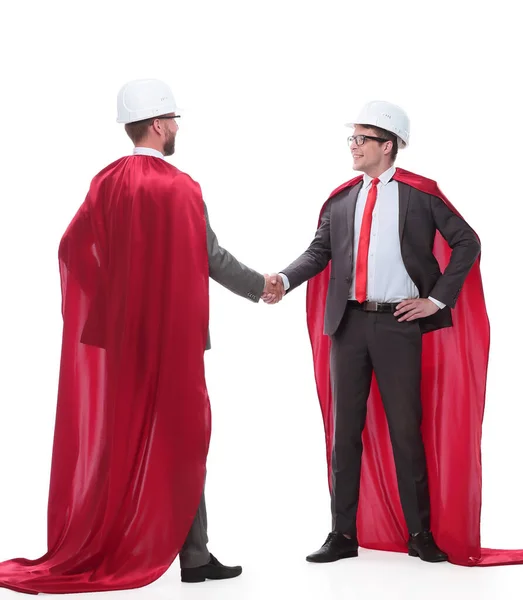 Architect and developer in capes super heroes shaking hands — Stock Photo, Image