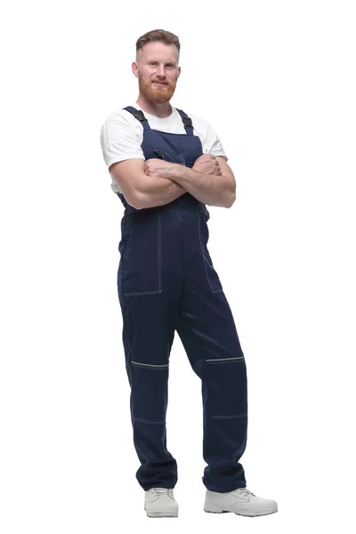 In full growth. confident bearded man in overalls . — Stock Photo, Image