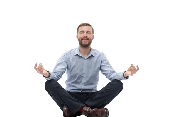 Jungunternehmer meditiert auf dem Boden sitzend — Stockfoto