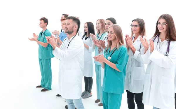 Groep van jonge medische professionals applaudisseren hun leider. — Stockfoto