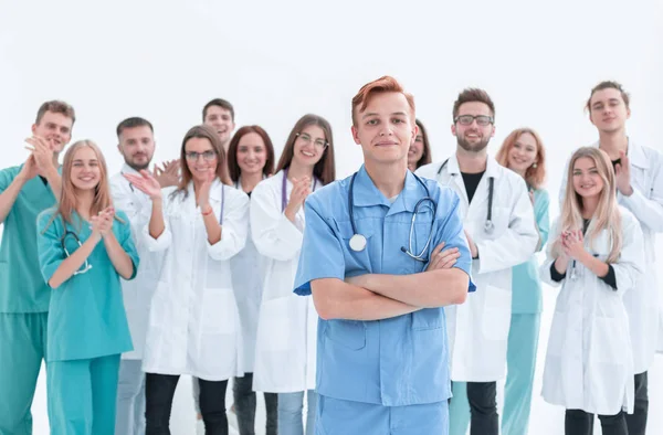 stock image top view. a group of smiling doctors pointing at you.