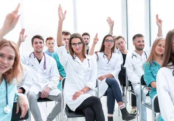 Top view. a group of smiling doctors pointing at you. — Stock Photo, Image